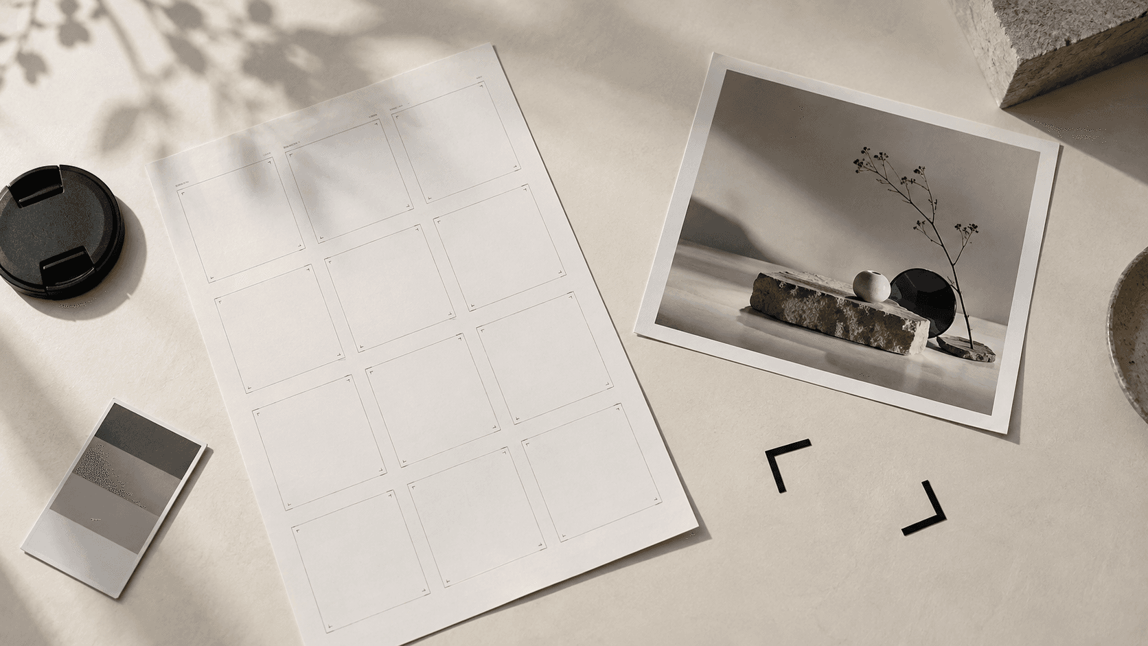 Illustrative planning desk with an empty photography contact sheet, colour card and unbranded product photograph.